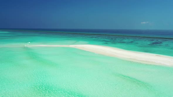 Aerial flying over texture of exotic lagoon beach voyage by blue sea with white sand background of j