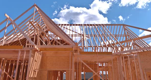 A Roof Beams Frame of a Home a the House with Beginning Construction Site