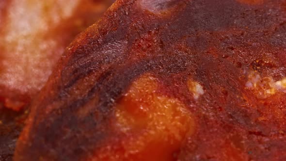 Macro shot of intense red spanish chorizo slices.