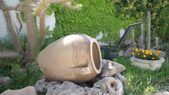 Handmade Old Ceramic Amphora for Storing Oil Used to Furnish a Garden in the Puglia Countryside