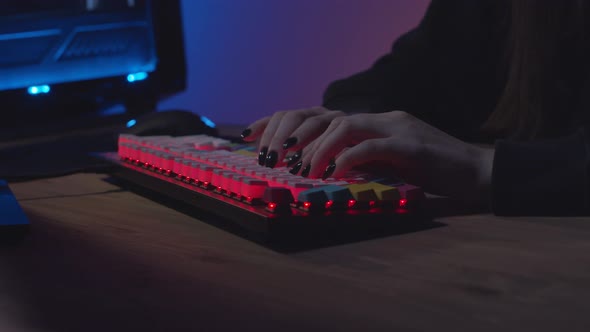 Girl Typing on Keyboard with Black Nails