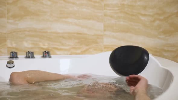 Tired Young Man Taking Bath, Trying to Relax After Hard Working Day, Leisure