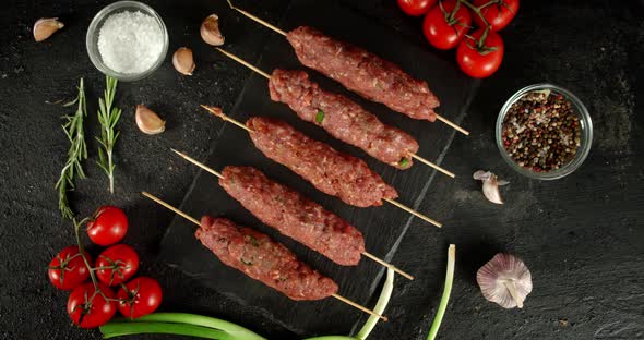 Raw Kebab Sausages on a Stick Slowly Rotate