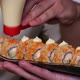 The cook finishes putting chees on philadelphia roll - VideoHive Item for Sale