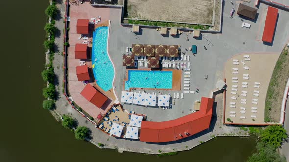 Aerial top view of public swimming resort pool