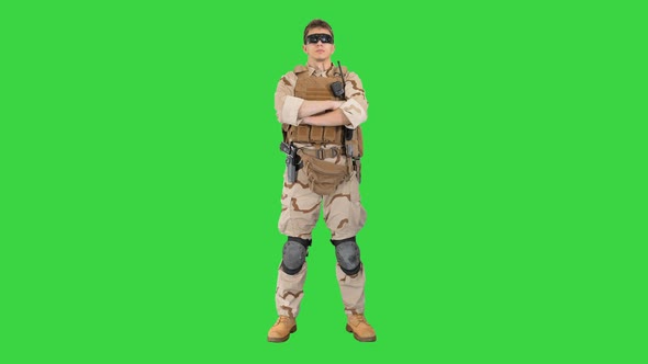 Private Military Contractor with Crossed Arms on a Green Screen, Chroma Key