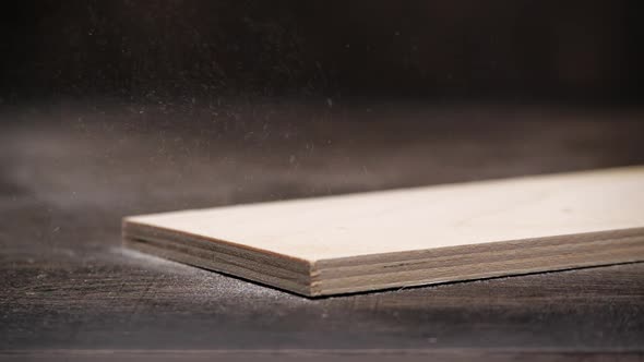 Anonymous Carpenter Removing Dust From Wooden Board