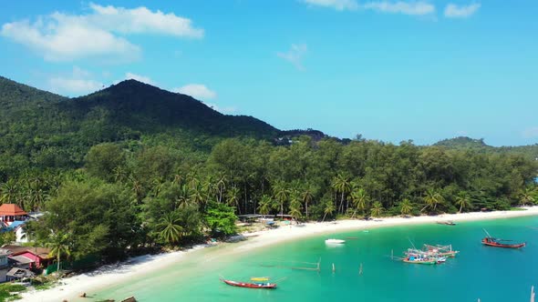 Aerial drone view sky of tranquil coastline beach journey by shallow lagoon with clean sandy backgro