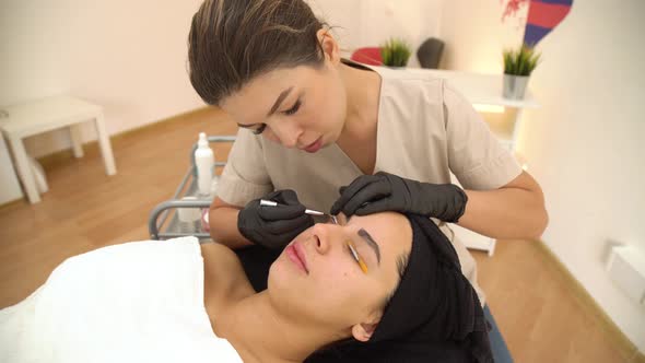 A Beautiful Girl in a Beauty Salon Does a Lamination Lashes