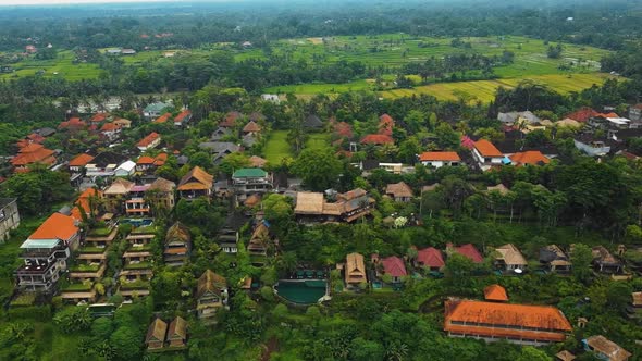 Beautiful cinematic Ubud, Bali drone footage with exotic rice terrace, small farms, village houses a