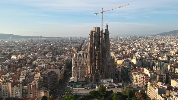 Aerial drone view of Barcelona, Spain. Blocks with multiple residential buildings and Sagrada Famili