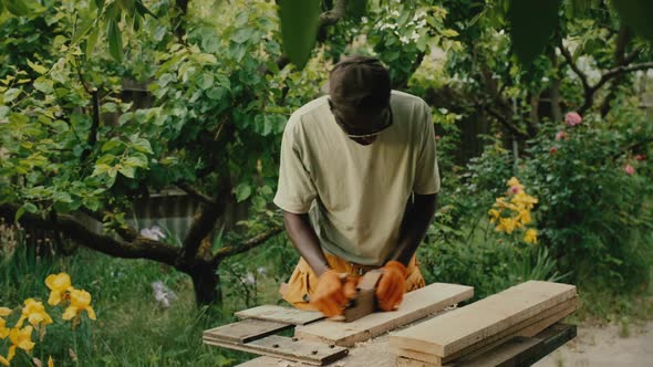 Carpenter Uses Jackplane to Remove Rough Surface on Wood