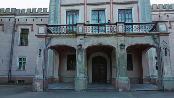 Vecauce Manor in Latvia Aerial View of the Pink Castle Through the Park. Vecauce Castle Tower With a