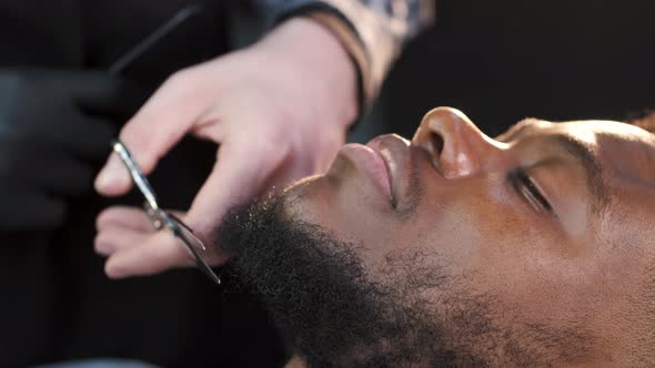 African American Client Having Haircut at Barber's
