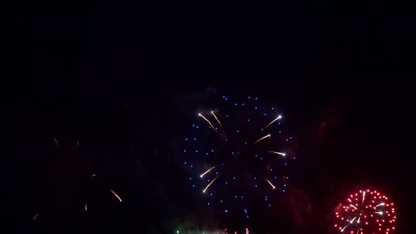 Colorful Firework display at night on sky background alt