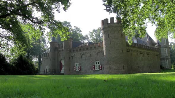 Low slider shot of castle with greenfield.