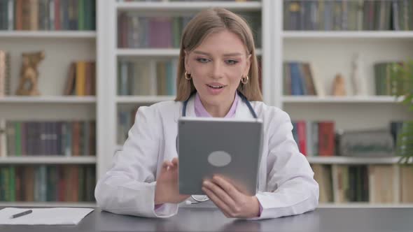 Lady Doctor Celebrating on Tablet in Clinic