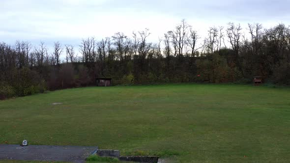 Skeet Shooting. Oranges skeet shooting On Gras Field. wide slider