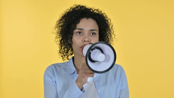 Portrait of Casual African Woman Making Announcement on Loudspeaker