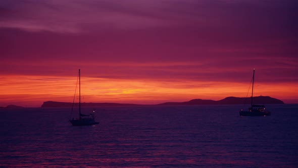 Pink Sunset Afterglow with Sailing Ships and Yachts and Island Mountains in The Background  4k