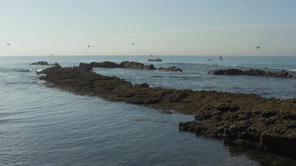 Fishing boat around Cascais coast in Portugal