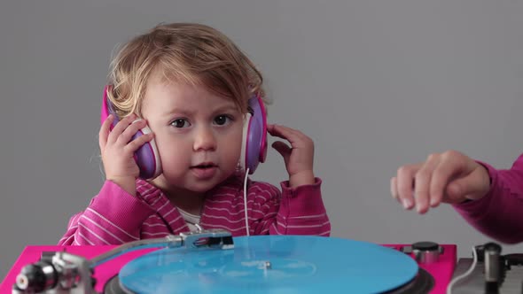 Two Girls Playing with Record Players