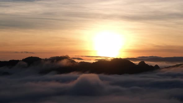 Landscape of mountains and hills with the sea of fog while the sun rising