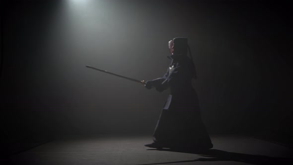 Kendo Instructor Practicing Martial Art with the Katana Katana Shinai