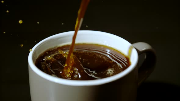 Pouring coffee into cup, Ultra Slow Motion