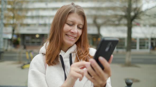 Beautiful Woman In The City Drinks Coffee