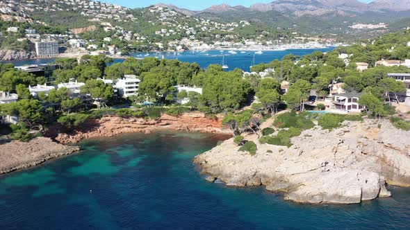 Cala Marmassen Cove at Port Andratx in Mallorca Spain with resorts and homes by the beach, Aerial do