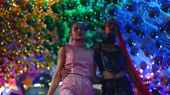 Clubbers In Pvc Fashion Walking And Smiling Amongst Neon Lights