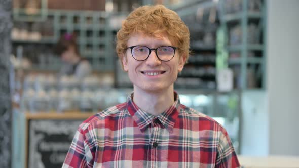 Young Redhead Man Shaking Head in Approval, Yes Sign 