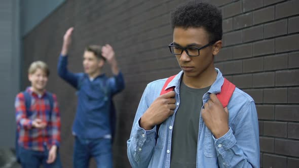 Cruel Teenagers Teasing African American Boy, Immigrant Newcomer Facing Racism