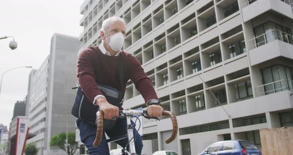 Caucasian man out and about in the street wearing on a face mask against coronavirus