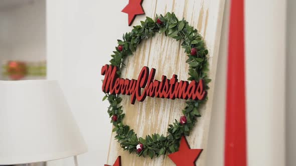 Festive Decorated Christmas Wreath with Red Little Balls on the Green Leaves