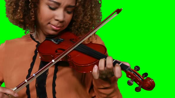 Close-up of female musician playing violin