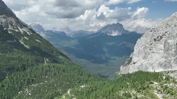 Hikers and travelers enjoy the beautiful mountain views as they have a walk in the Dolomites