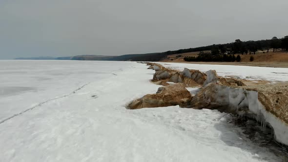 Ice on Frozen Lake or River in Winter Aerial View Above Surface Amazing Northern Nature