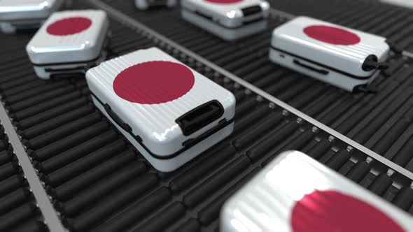 Suitcases Featuring Flag of Japan Move on Conveyor
