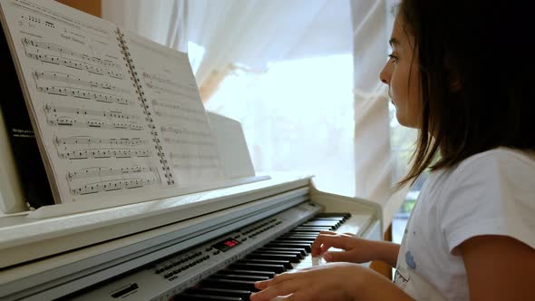 Child Girl Playing the Piano