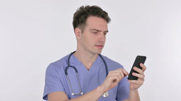 Young Doctor Browsing Smartphone on White Background