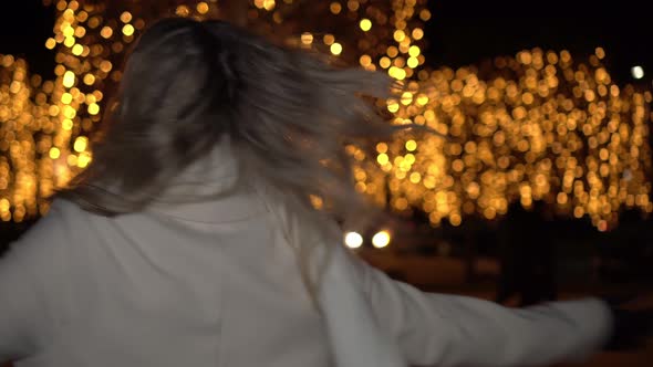 Young Happy Woman Enjoying Christmas Evening Outdoors