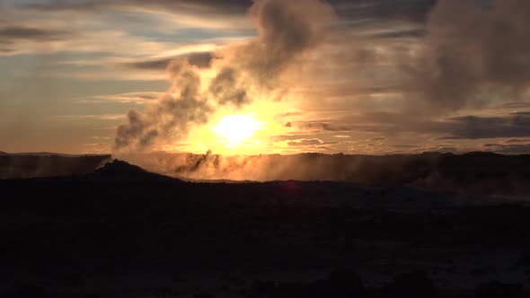 Iceland. Geothermal region area valley with smoking fumaroles and hot streaming water from geysers.