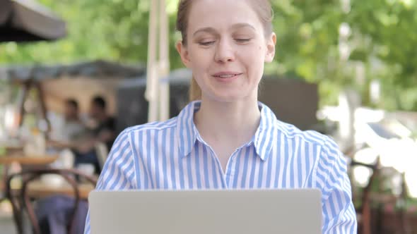 Close Up of Woman Using Laptop and Drinking Coffee Cafe Terrace