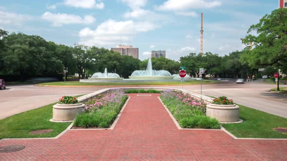 This video is about a time lapse of cars near big water fountain in the Houston museum district. Thi