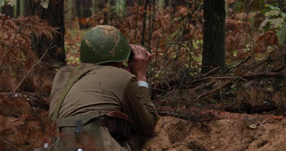 Hidden Reenactor Dressed Like Russian Soviet Infantry Red Army Soldier In World War II Sitting In