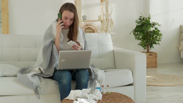 Sick Woman Sits at Home on the Couch Calls the Doctor and Consults
