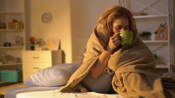 Ill Female Covered Blanket Drinking Hot Tea Sitting on Bed, Health Care, Virus