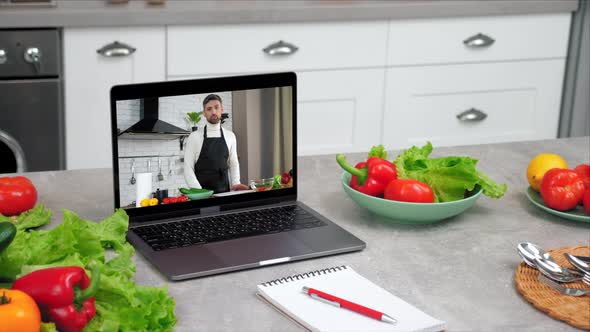 Laptop Computer with Man Chef Food Blogger Tells Teaches Housewife Students